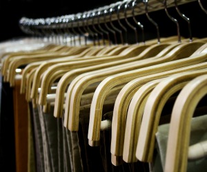 row of hangers in wardrobe