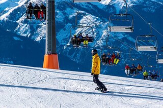 snowboarder and ski lift