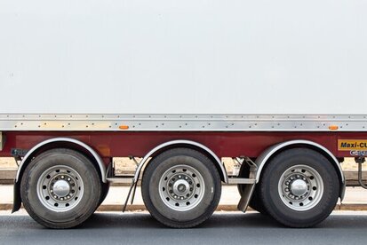 view of side and wheels of white truck