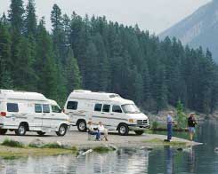motorhomes parked by a lake