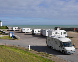 campervans parked by beach