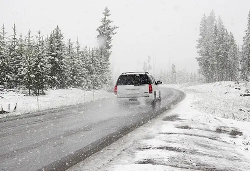 snowy road car