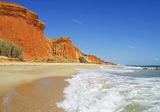 algarve beach with red sandstone cliffs