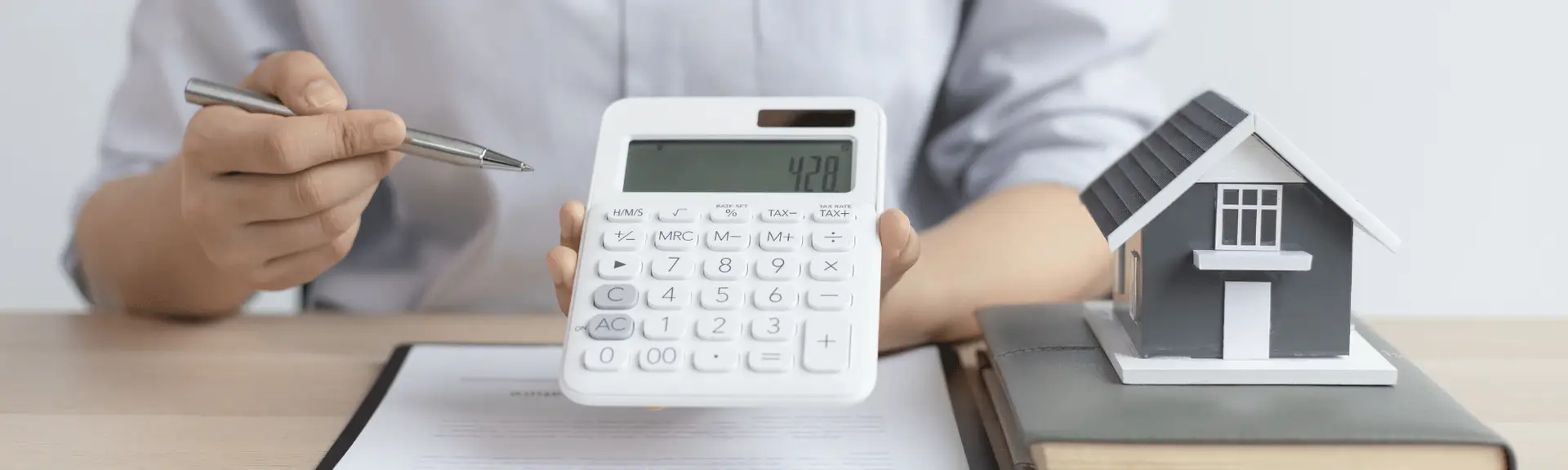 calculator and miniature house