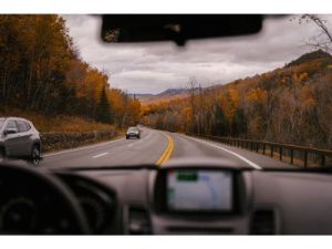 view from inside a car looking out of the windscreen to the road ahead