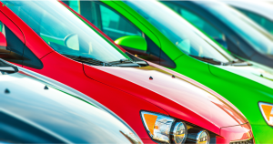 brightly coloured cars parked in a row